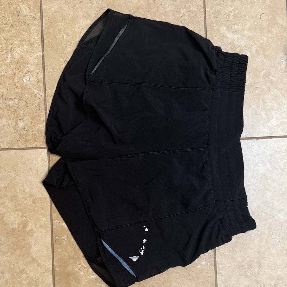 Black lululemon 4’ hotty hot shorts with Hawaii logo